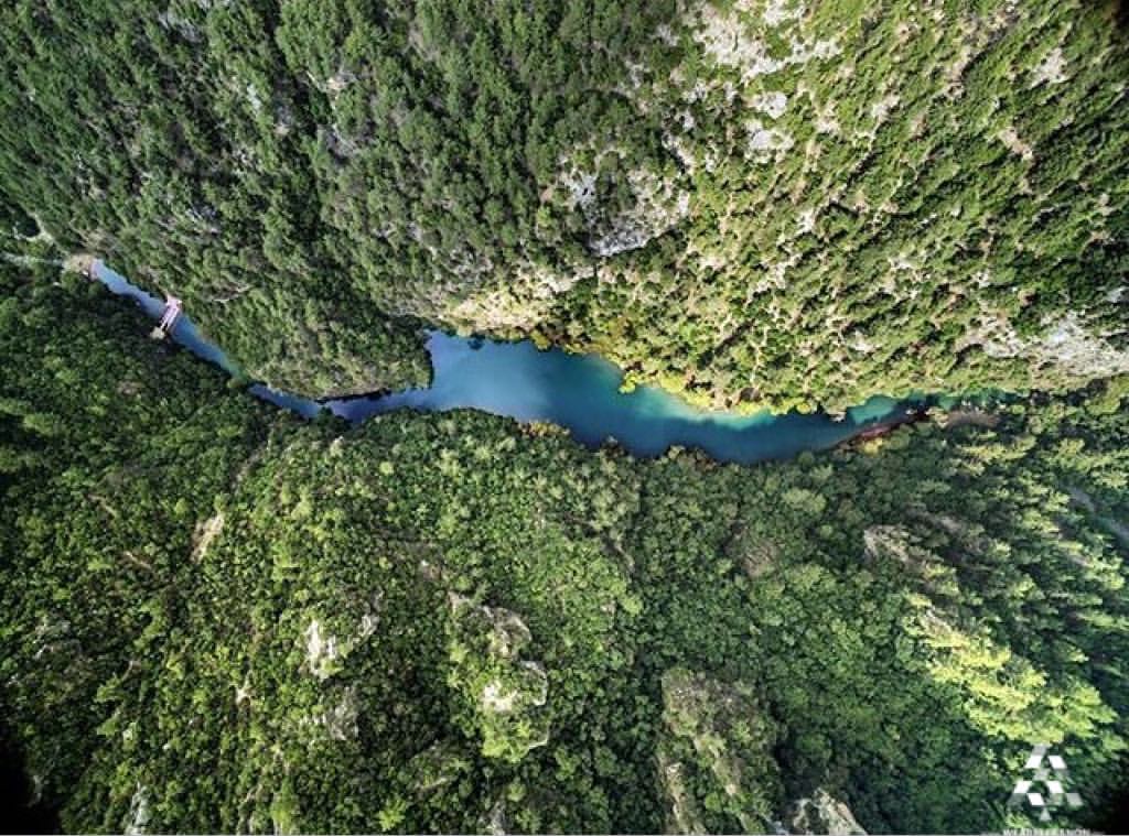 View from the top of the river, green valley, turquoise water